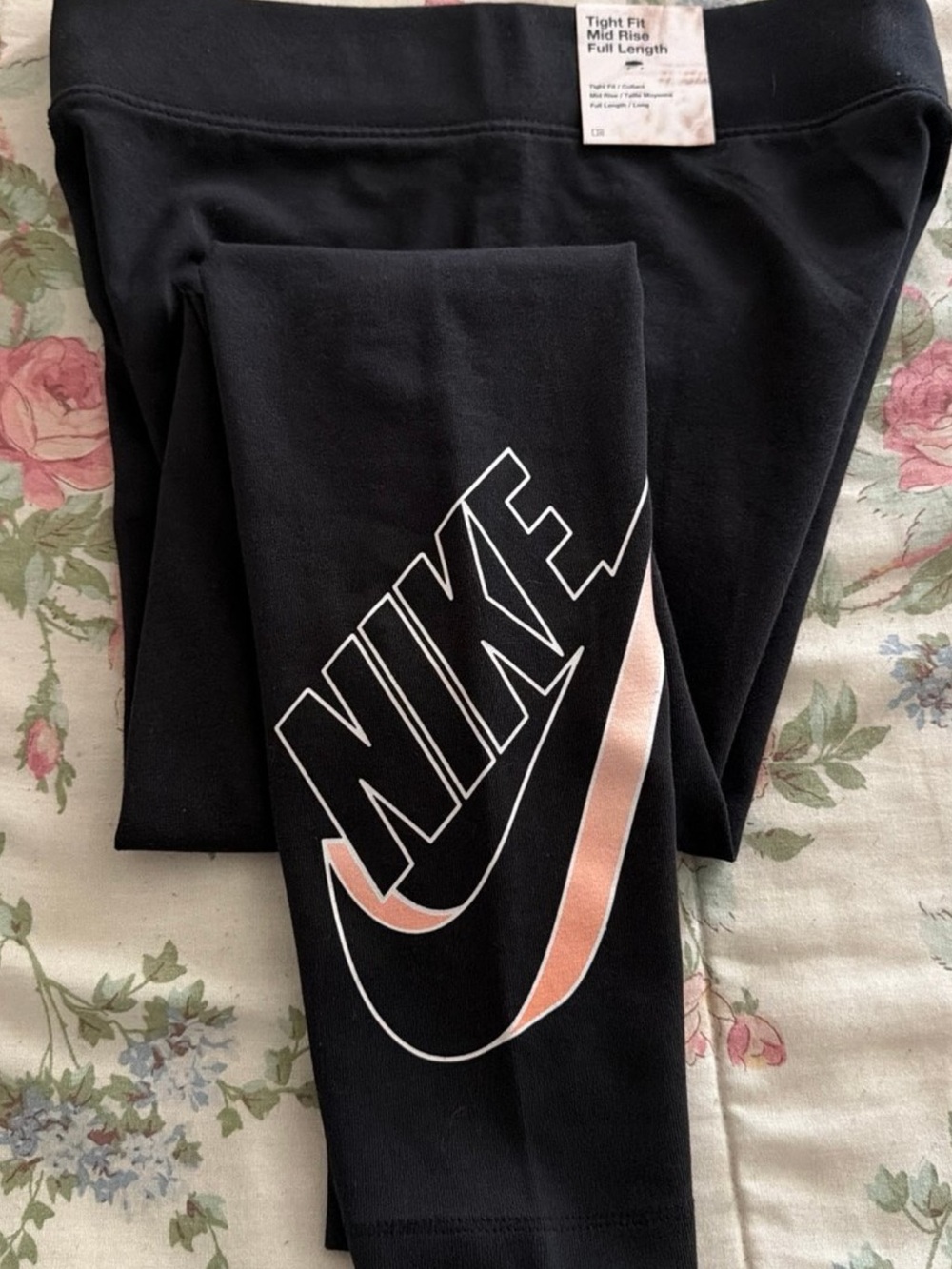 Nike Black Tight-Fit Mid-Rise Full-Length Leggings with Pink Swoosh Accent